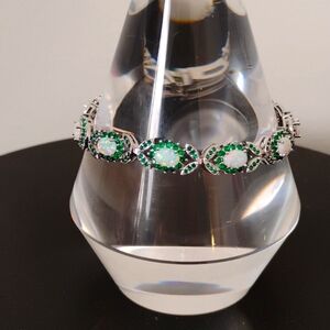 Silver- Opal and Green Emerald Halo bracelet w box clasp/ saftee latch. 7 1/2"